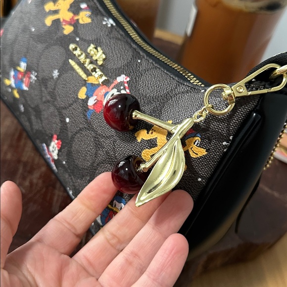 Coach Brown Signature Canvas Disney Holiday Wristlet with Gold Hardware - Picture 2 of 4